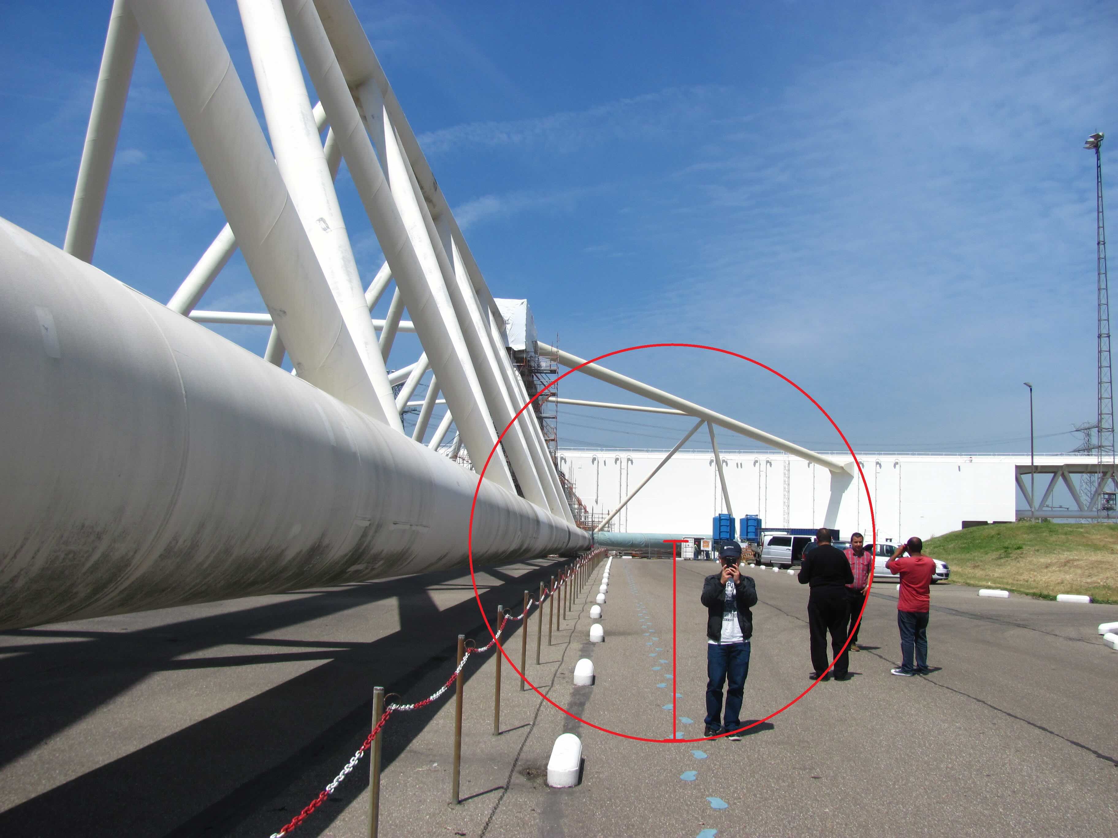 Picture of me standing close to one barrier of the Maeslantkering. Red drawings are from Fabio to demonstrate his "new unit" idea.